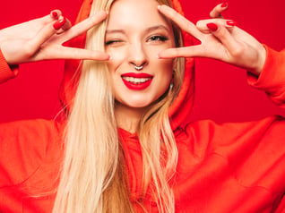 portrait-young-beautiful-hipster-bad-girl-trendy-red-hoodie-earring-her-nose-positive-model-shows-peace-sign